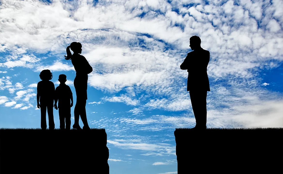 silhouette of a man and woman standing on a cliff opposite to each other