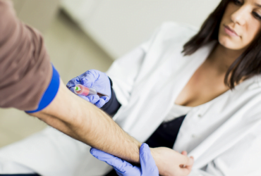 a person getting an injection from a doctor